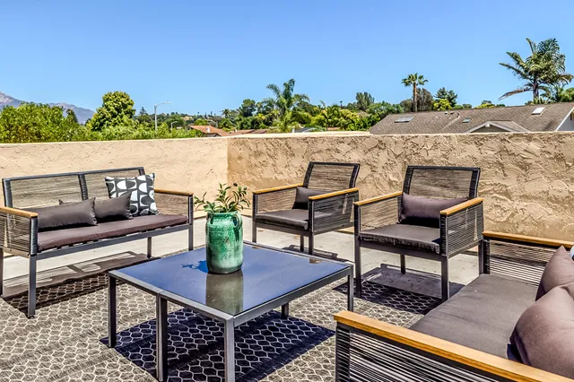 a view of a chairs and table in a patio