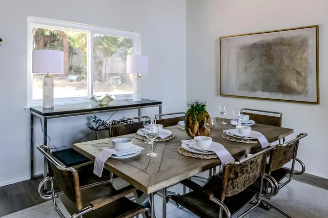 a view of a dining room with furniture window and outside view