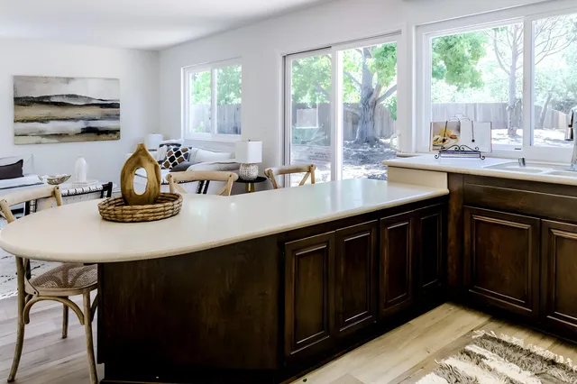 a kitchen with a sink cabinets and window