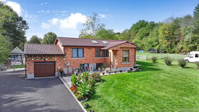 front view of a house with a yard