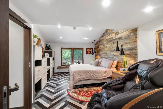 a bedroom with furniture and a fireplace