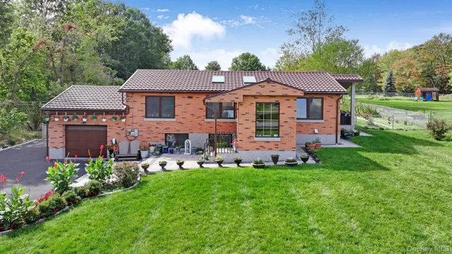 a front view of a house with garden