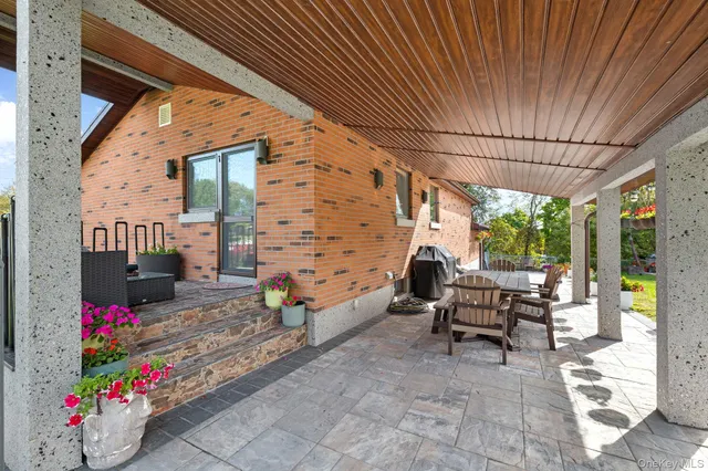 a view of a backyard with sitting area
