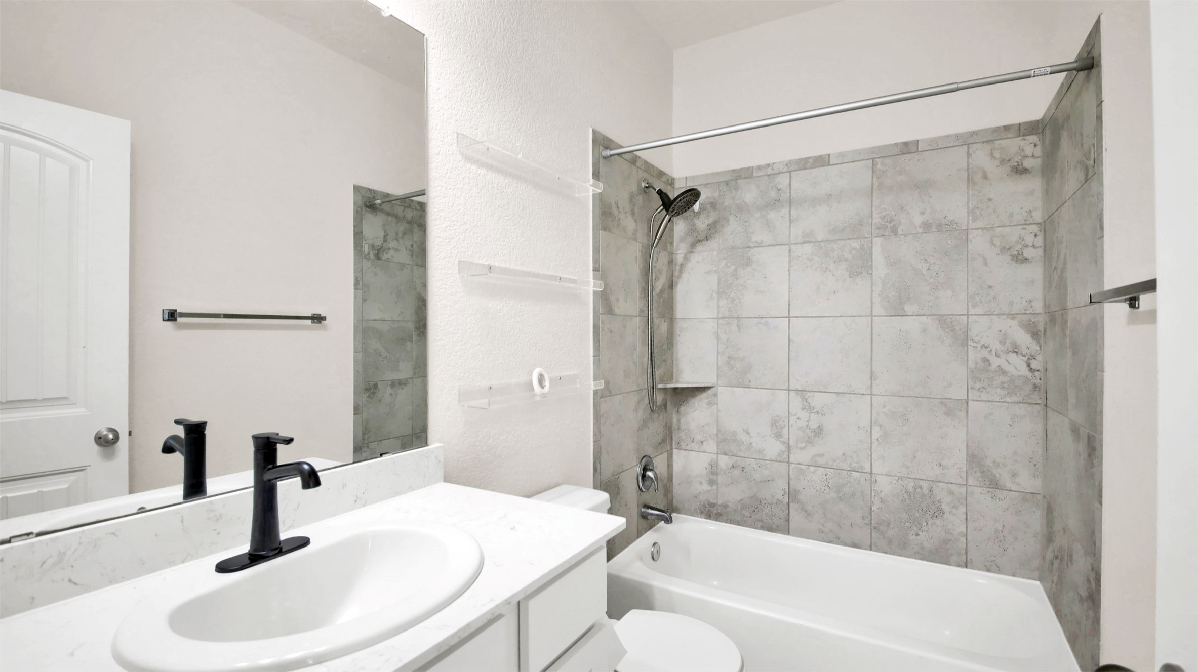 19032 Quebrada Drive Pflugerville, TX 78660 - Photo 16 of 29 a bathroom with a sink and a mirror