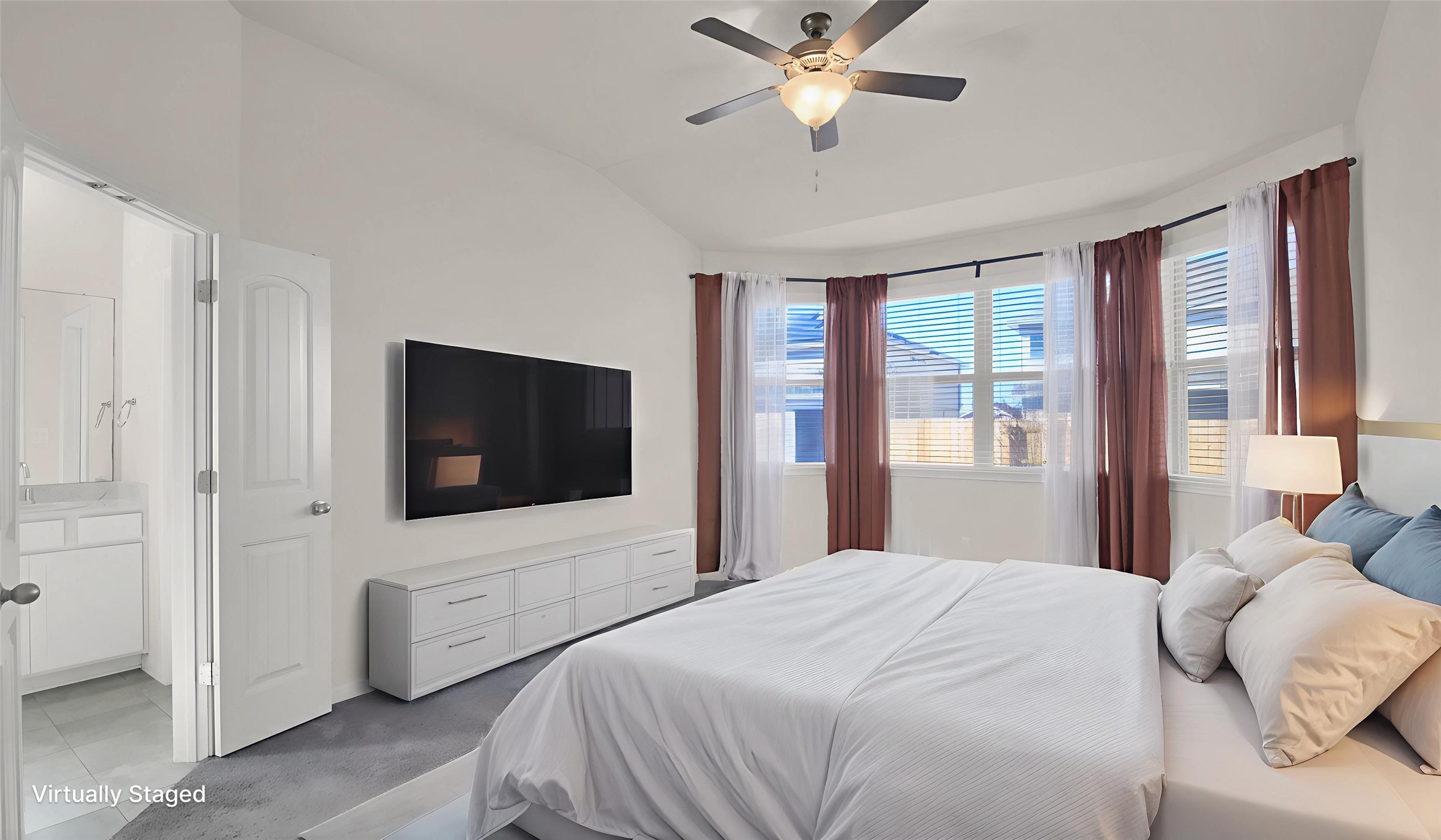 19032 Quebrada Drive Pflugerville, TX 78660 - Photo 20 of 29 a bedroom with a bed tv and a window