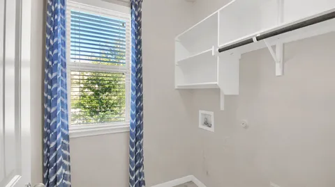 a view of walk in closet with window