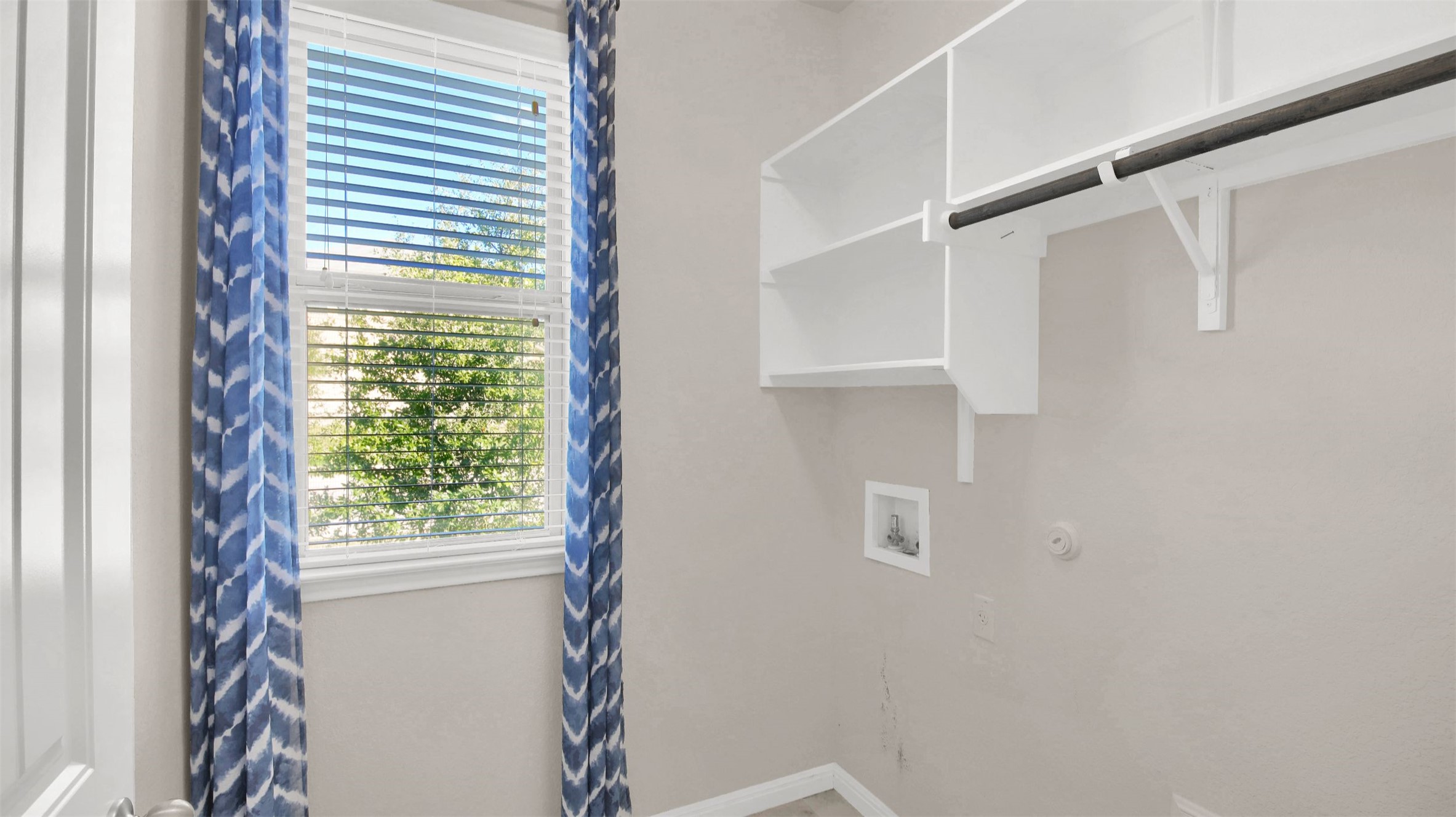 19032 Quebrada Drive Pflugerville, TX 78660 - Photo 24 of 29 a view of walk in closet with window
