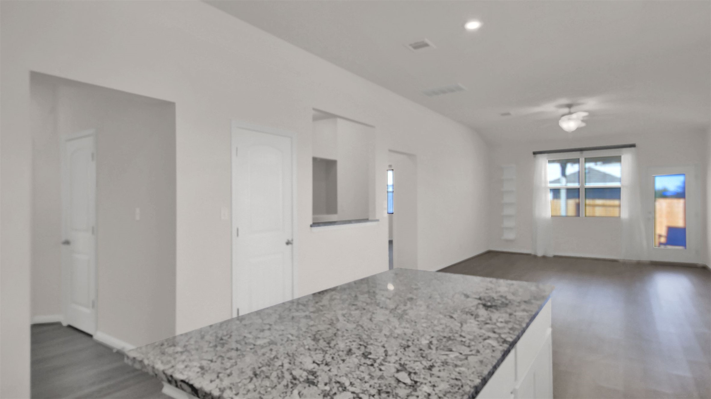 19032 Quebrada Drive Pflugerville, TX 78660 - Photo 8 of 29 an empty room with wooden floor and window