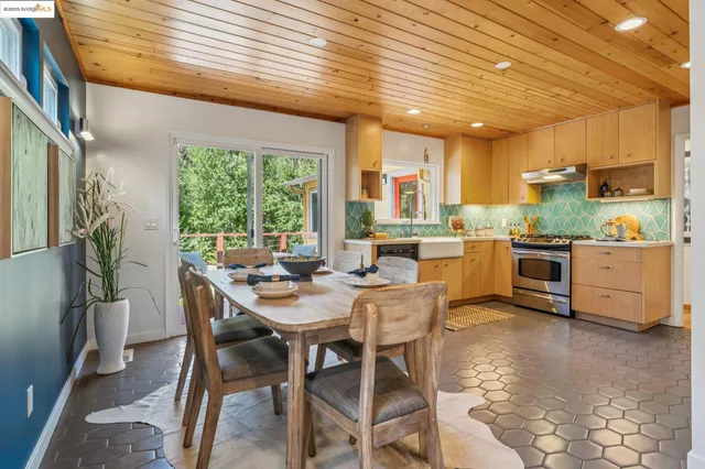 a view of a dining room with furniture window and outside view
