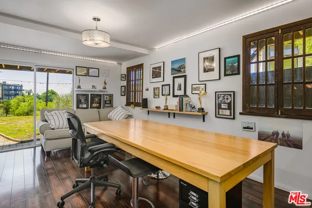 a room with furniture and pool table