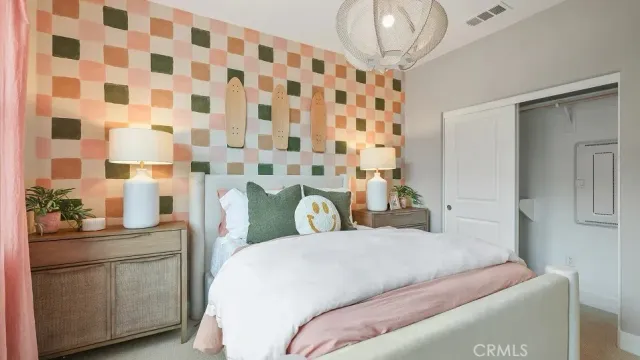 a bedroom with a bed and a sink