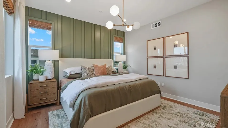 1723 Lychee Street Fullerton, CA 92835 - Photo 7 of 25 a bedroom with a bed and a chandelier