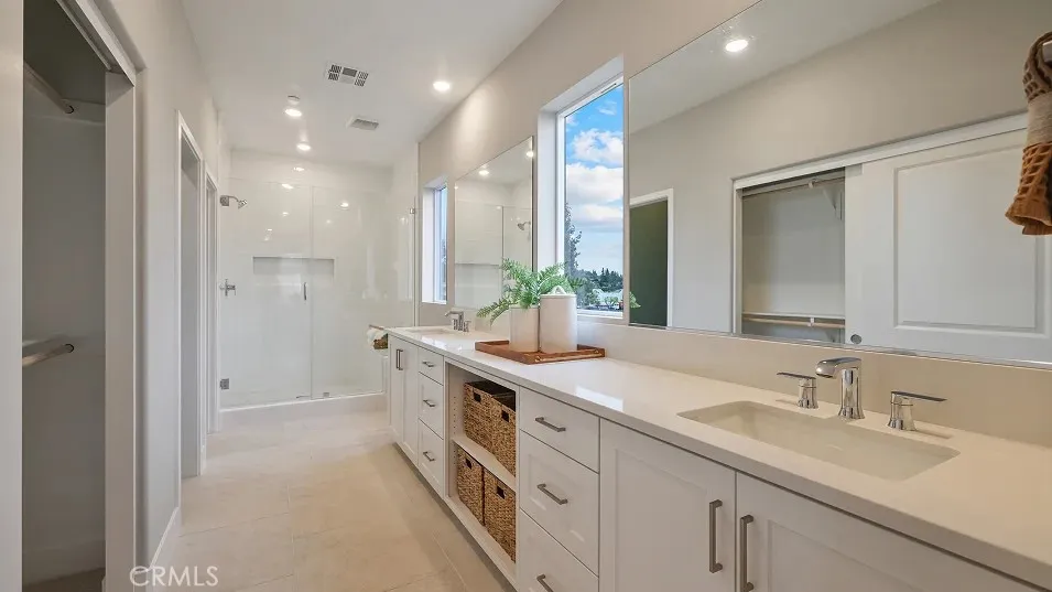 1723 Lychee Street Fullerton, CA 92835 - Photo 9 of 25 a spacious bathroom with a double vanity sink mirror and shower