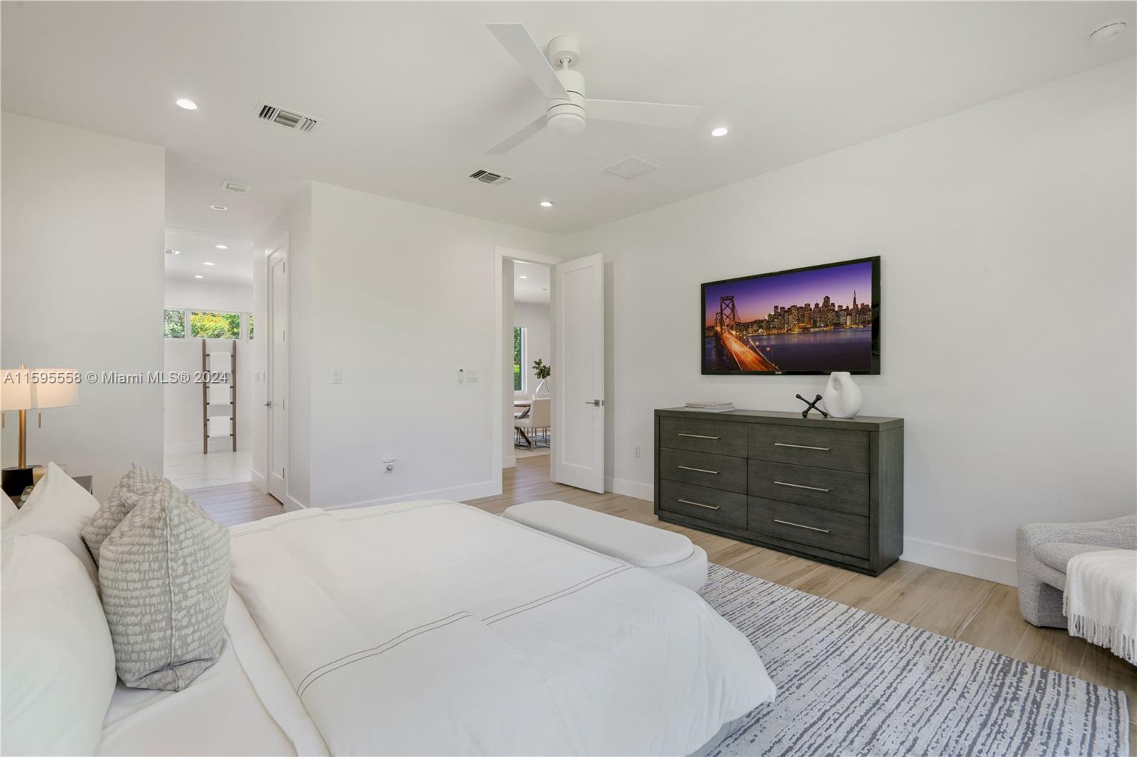 11815 Southwest 82nd Road Miami, FL 33156 - Photo 18 of 47 a bedroom with a bed and a flat screen tv