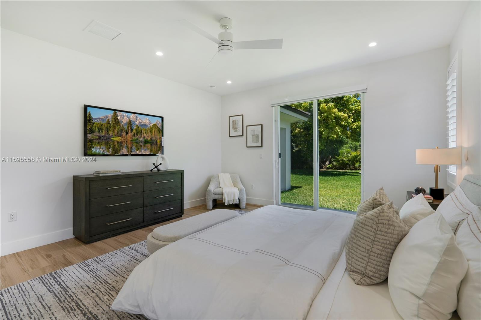 11815 Southwest 82nd Road Miami, FL 33156 - Photo 19 of 47 a bed room with a bed and a large window