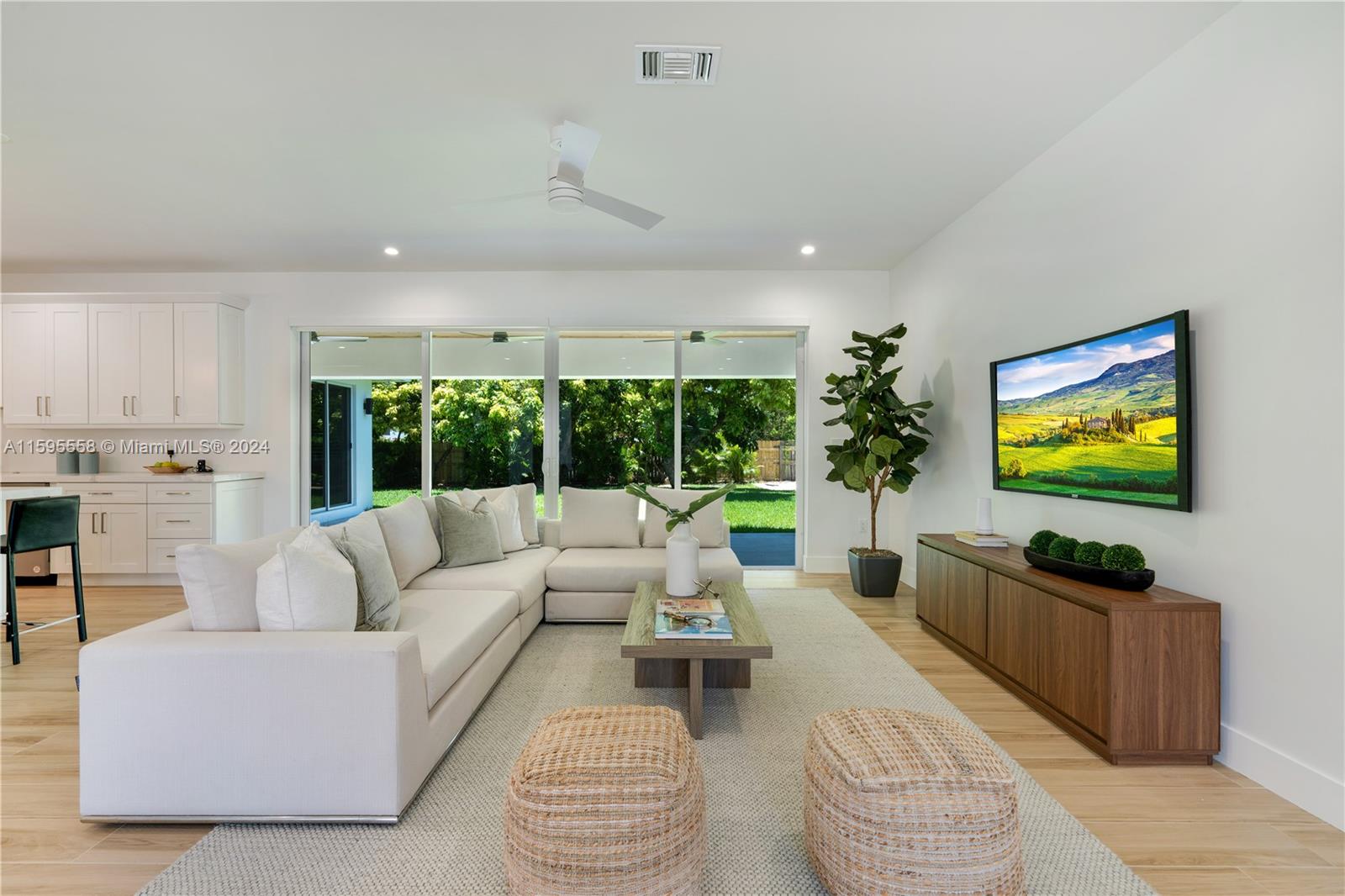 11815 Southwest 82nd Road Miami, FL 33156 - Photo 2 of 47 a living room with furniture kitchen view and a large window