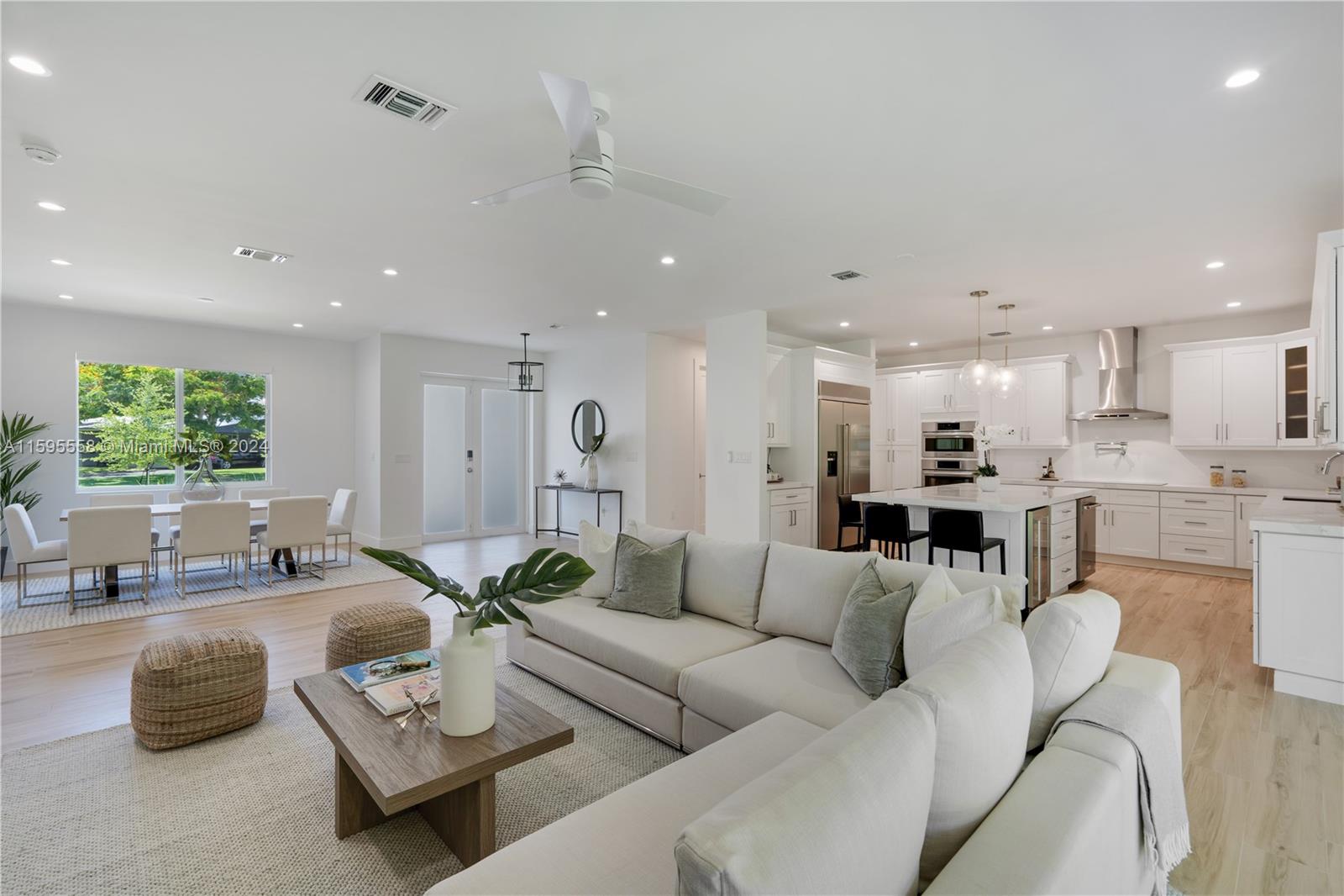 11815 Southwest 82nd Road Miami, FL 33156 - Photo 3 of 47 a living room with furniture and a view of kitchen