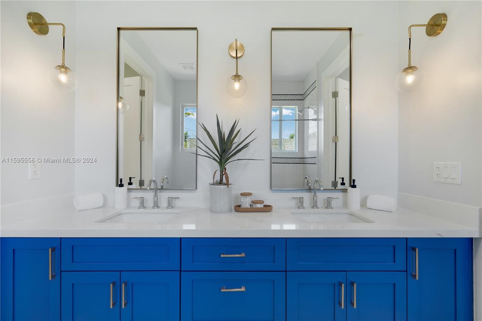 11815 Southwest 82nd Road Miami, FL 33156 - Photo 35 of 47 a bathroom with a double vanity sink and a mirror