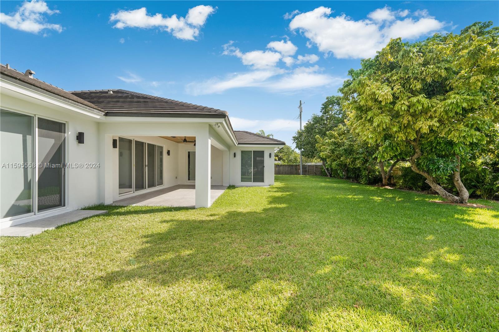 11815 Southwest 82nd Road Miami, FL 33156 - Photo 39 of 47 a view of a house with a backyard