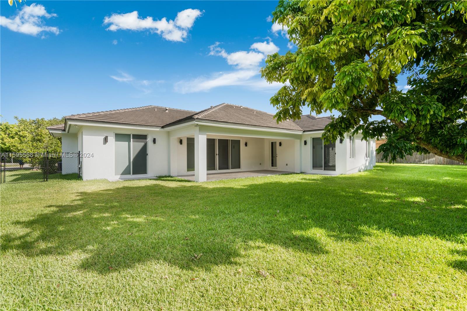 11815 Southwest 82nd Road Miami, FL 33156 - Photo 40 of 47 a view of a house with a backyard