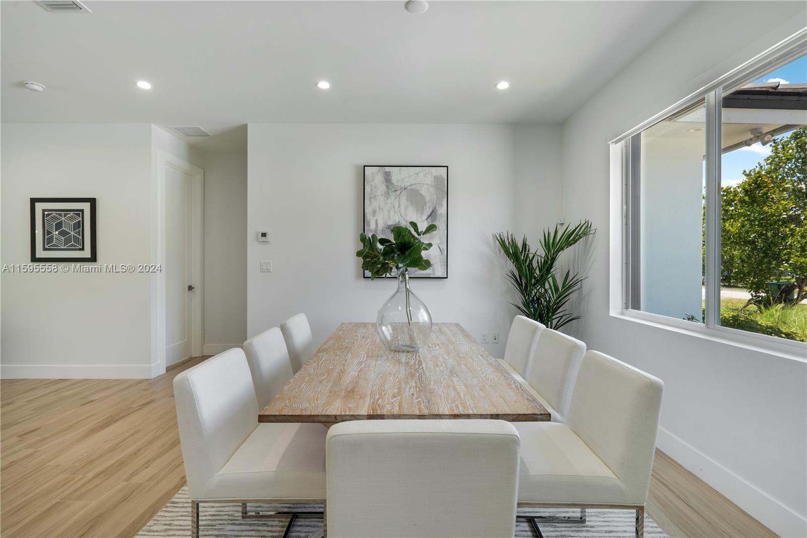 11815 Southwest 82nd Road Miami, FL 33156 - Photo 8 of 47 a view of a dining room with furniture window and wooden floor