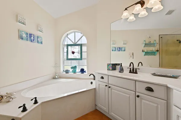 a bathroom with a sink a vanity and a mirror