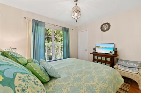 a bedroom with a bed and a table