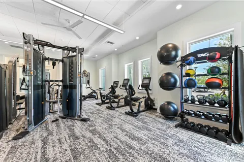a very nice looking room with lots of stuff and furniture