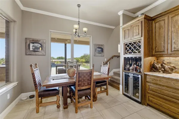 a view of a dining room with furniture window and outside view
