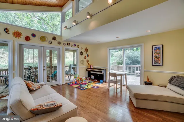 a living room with furniture fireplace and flat screen tv