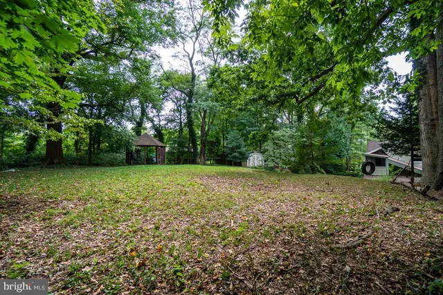 a view of outdoor space with deck and yard
