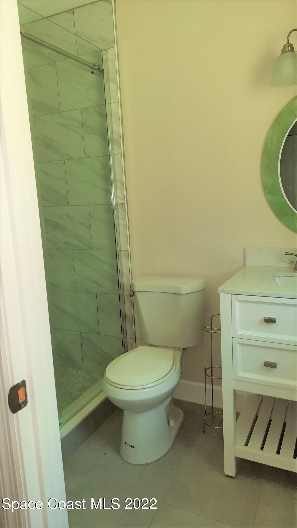 2300 Valkaria Road Malabar, FL 32950 - Photo 11 of 15 a bathroom with a toilet and a shower
