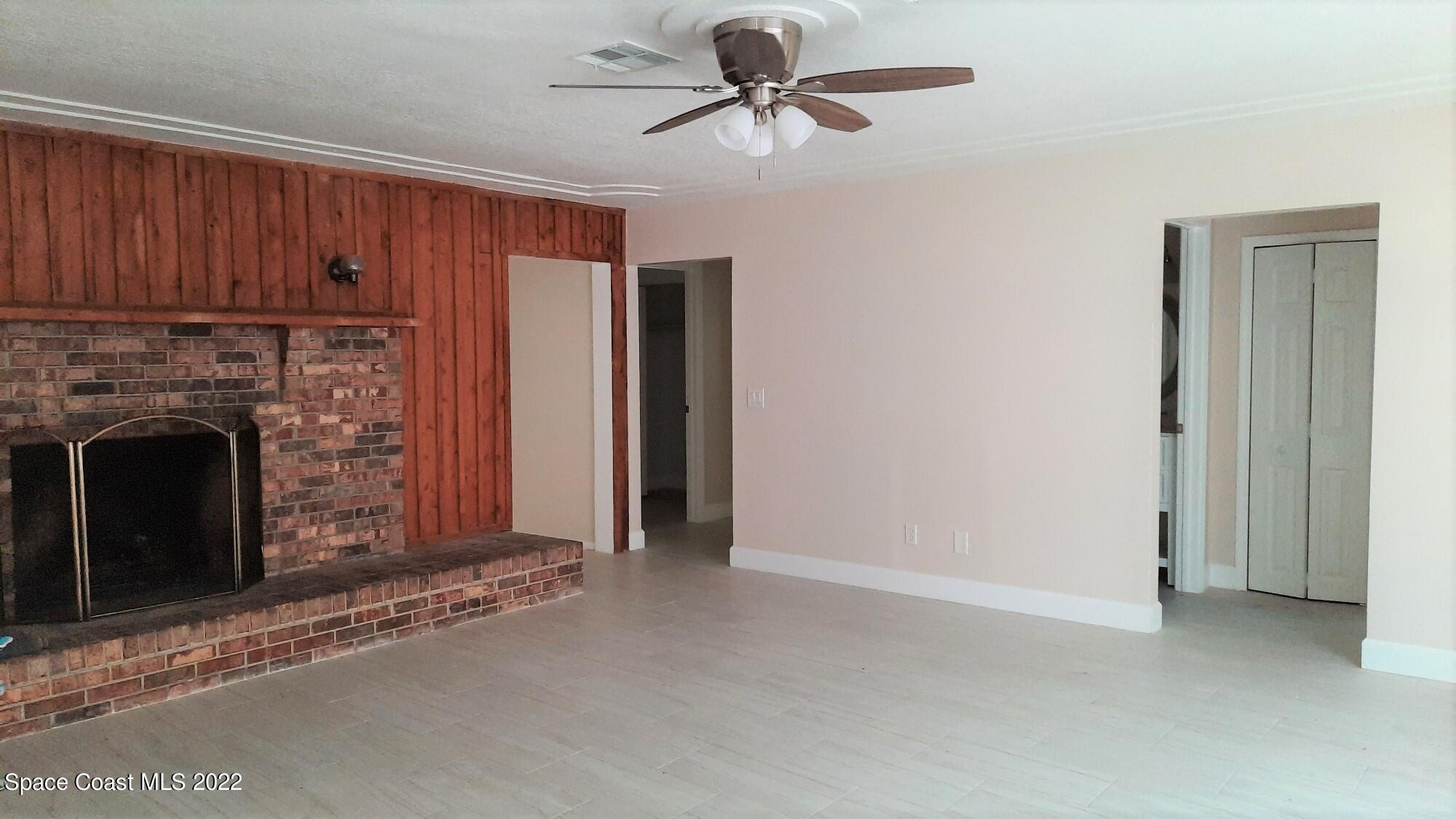 2300 Valkaria Road Malabar, FL 32950 - Photo 3 of 15 a view of a livingroom with an empty space and a fireplace