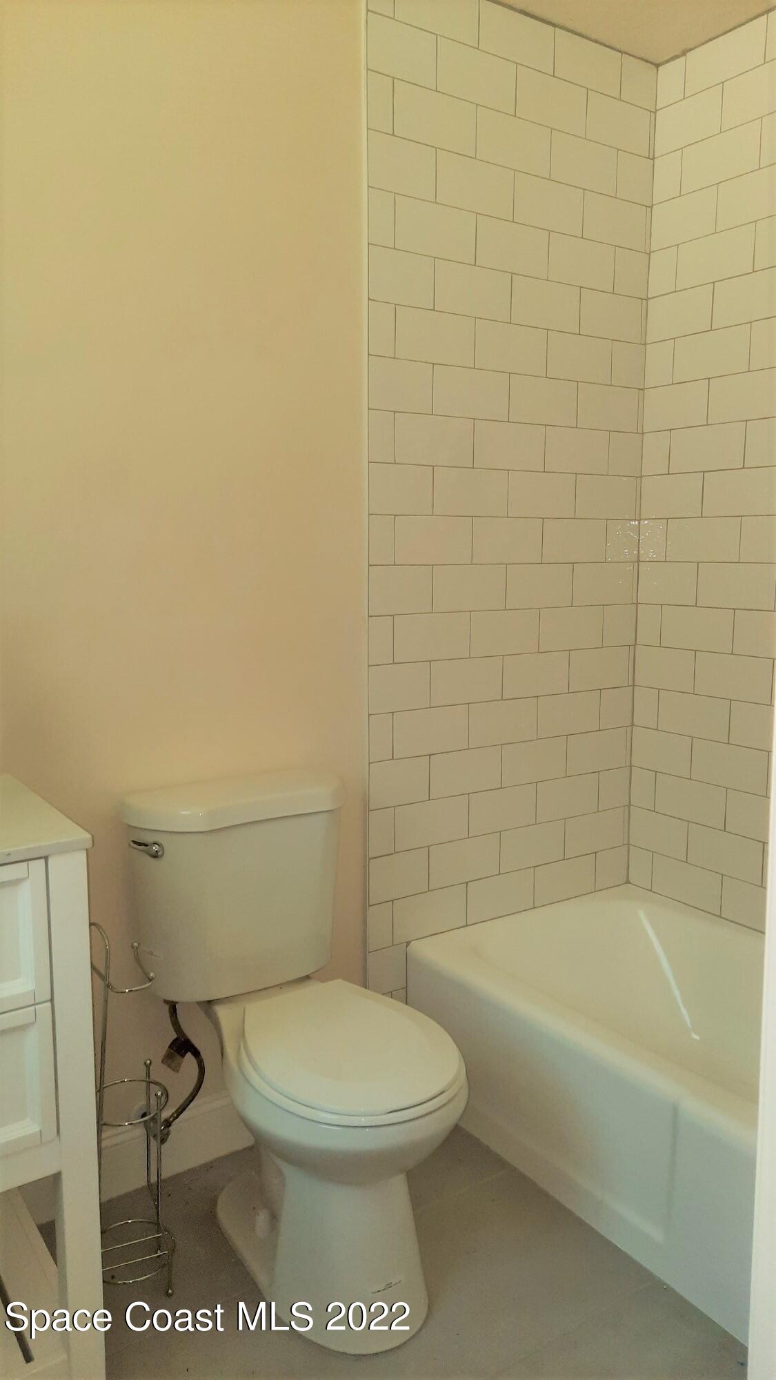 2300 Valkaria Road Malabar, FL 32950 - Photo 9 of 15 a bathroom with a toilet and a bathtub