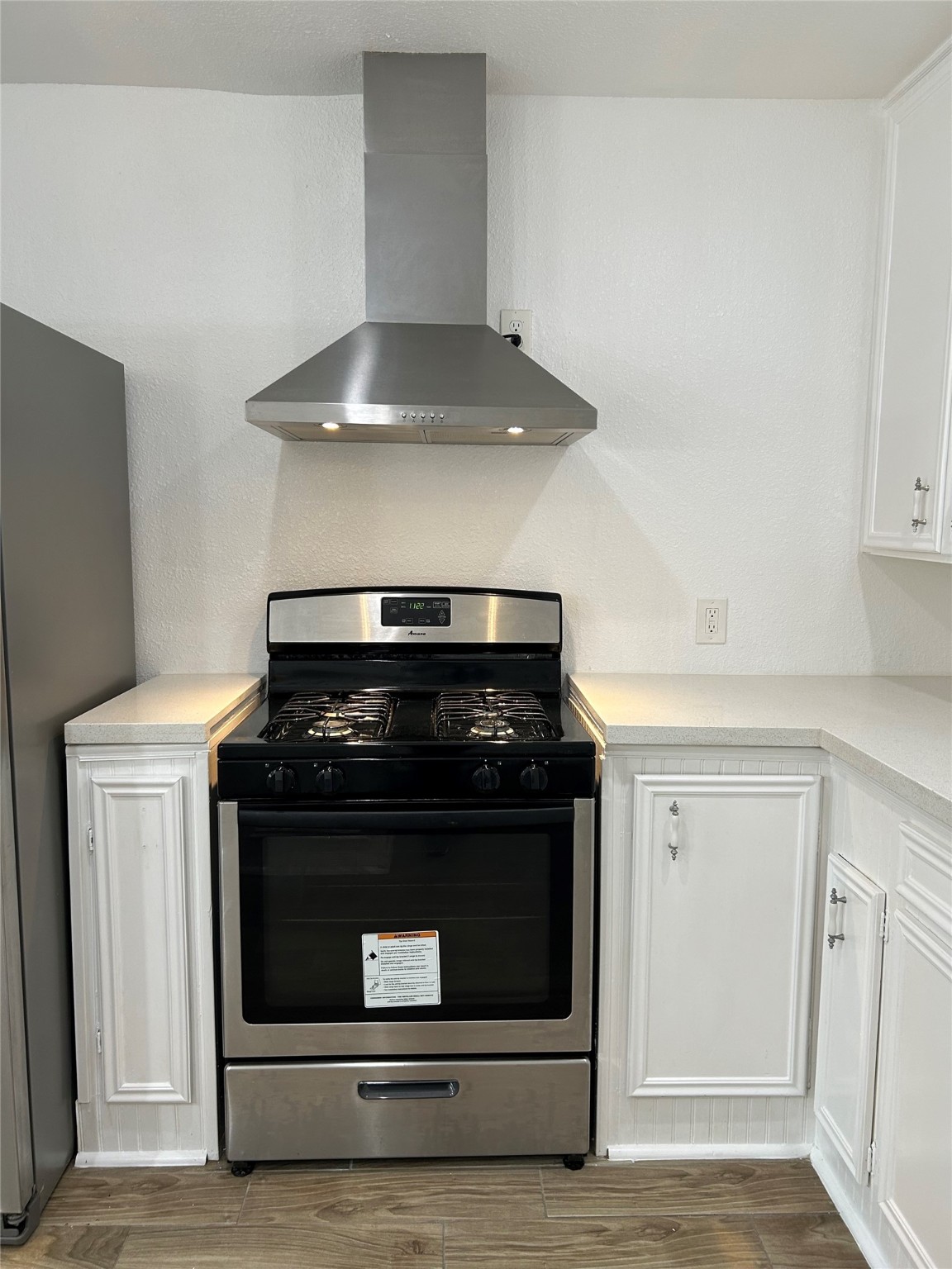 7410 Allsup Street Houston, TX 77061 - Photo 13 of 23 a stove top oven sitting inside of a kitchen
