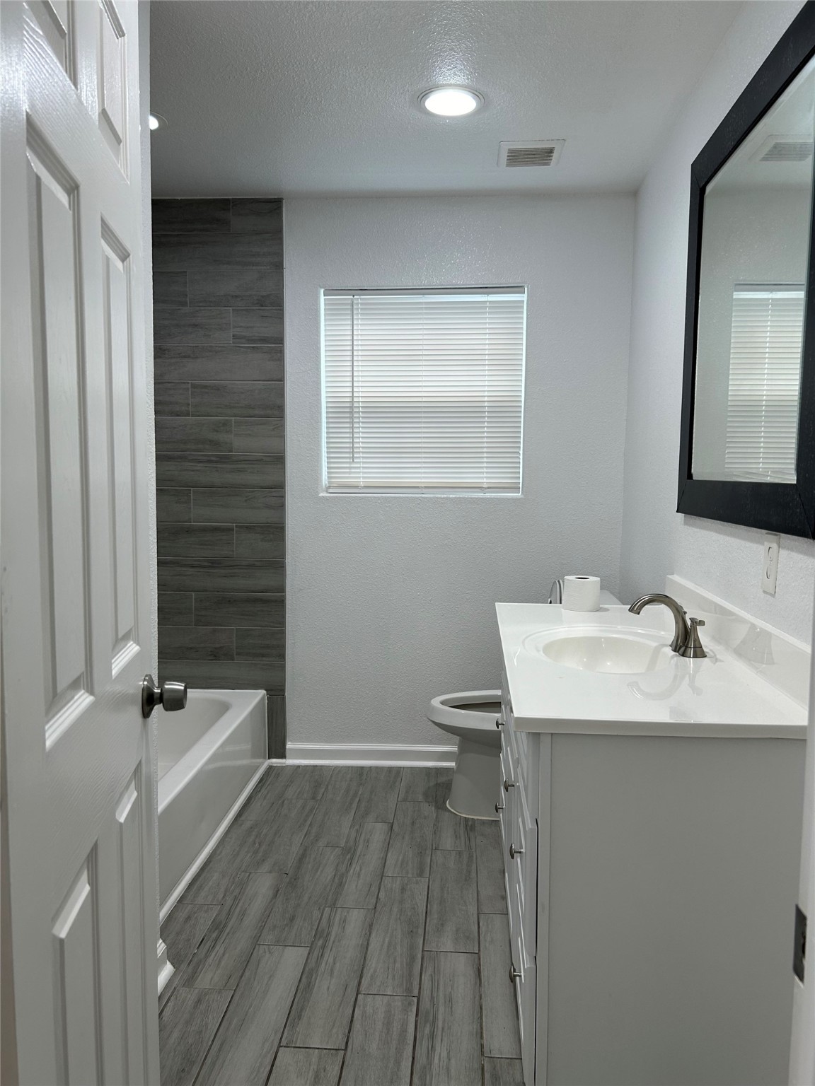 7410 Allsup Street Houston, TX 77061 - Photo 14 of 23 a bathroom with a sink a toilet and shower