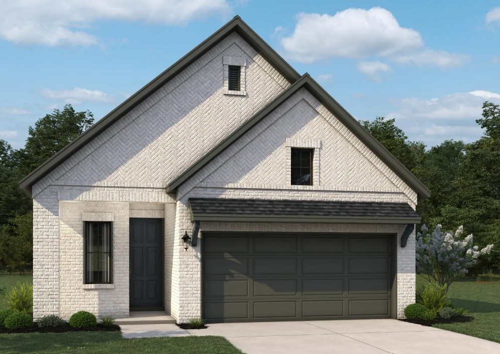 a front view of a house with garage