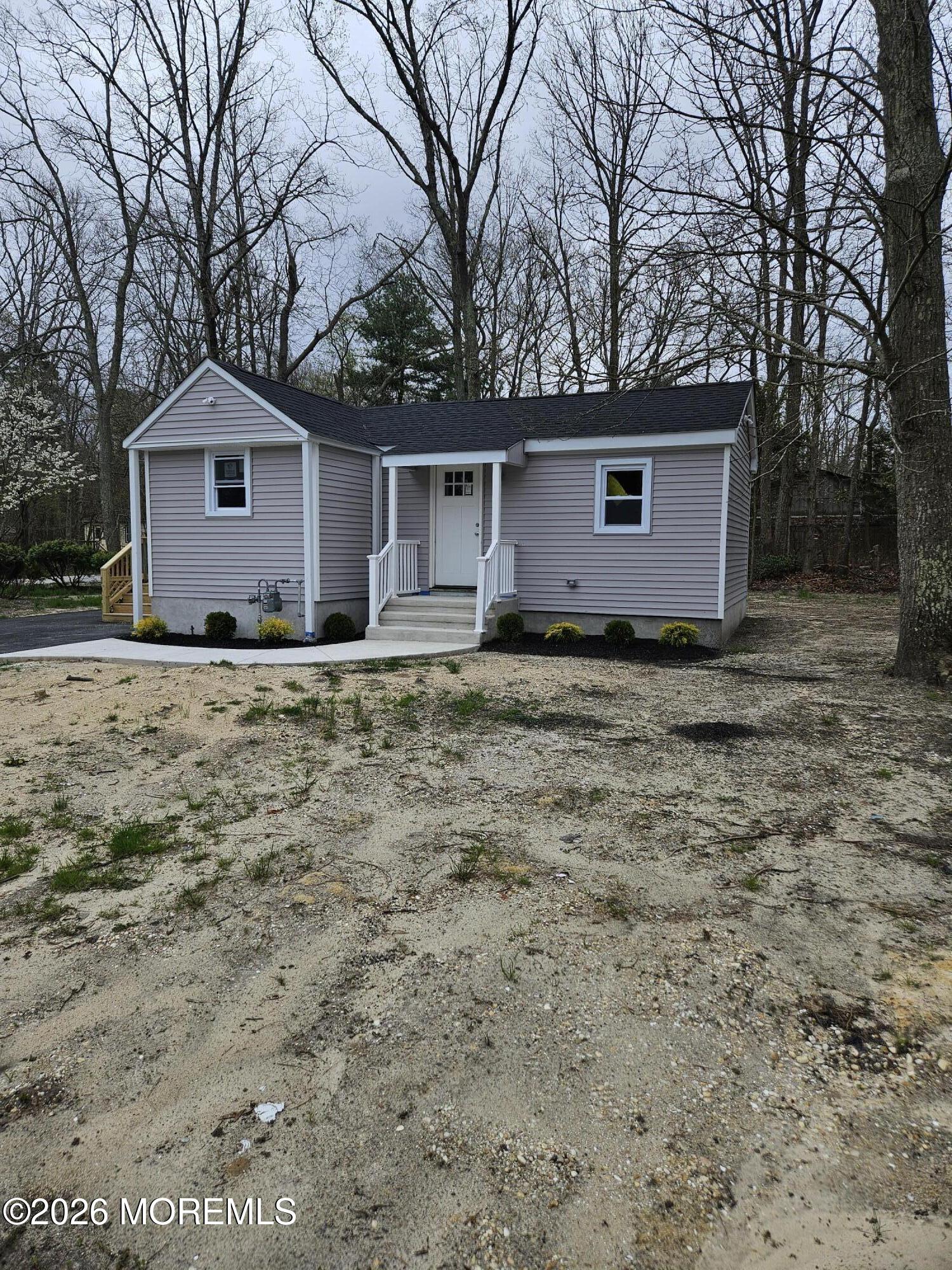 6611 Magnolia Drive Millville, NJ 08332 - Photo 14 of 14 a house with trees in the background