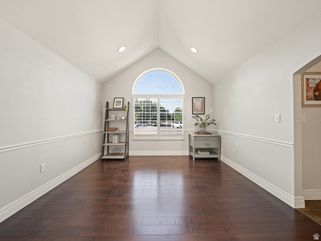 13357 Trail Rider Circle Draper, UT 84020 - Photo 22 of 70 Vaulted ceiling with recessed lighting, arched transom window, wood-finish flooring, and chair rail molding
