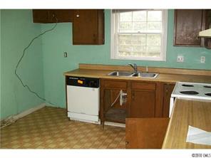 6015 Pepperhill Road Charlotte, NC 28212 - Photo 4 of 12 a kitchen with a sink cabinets and window