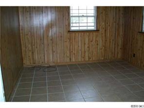 6015 Pepperhill Road Charlotte, NC 28212 - Photo 7 of 12 a view of an empty room with wooden door