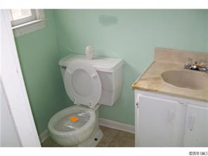 6015 Pepperhill Road Charlotte, NC 28212 - Photo 8 of 12 a bathroom with a sink toilet and vanity