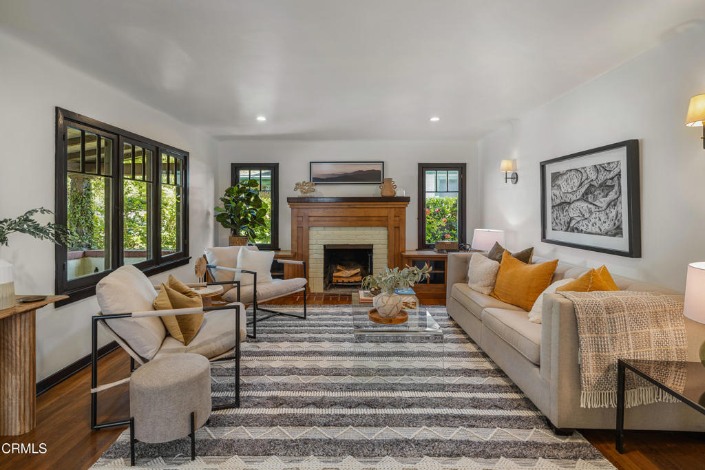 859 Sunset Avenue Pasadena, CA 91103 - Photo 11 of 76 a living room with furniture fireplace and large windows