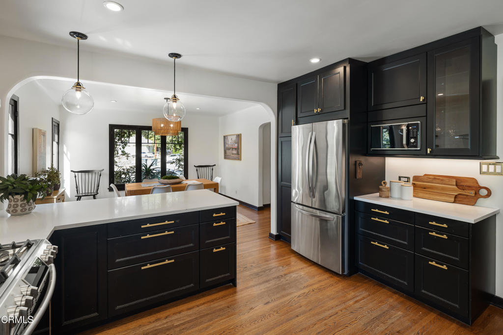 859 Sunset Avenue Pasadena, CA 91103 - Photo 22 of 76 a kitchen with a refrigerator and a stove top oven