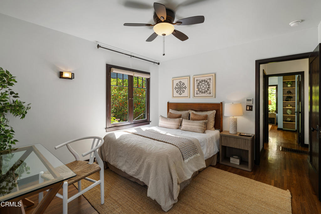 859 Sunset Avenue Pasadena, CA 91103 - Photo 30 of 76 a bedroom with a bed and a chandelier