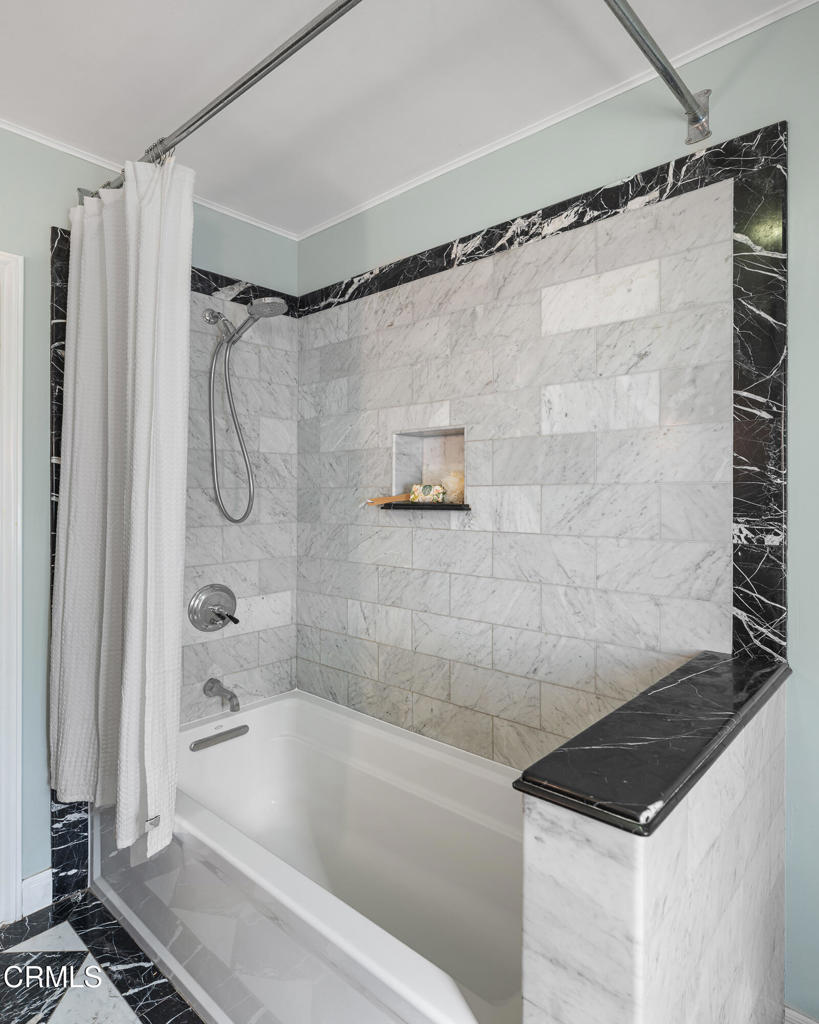 859 Sunset Avenue Pasadena, CA 91103 - Photo 35 of 76 a bathroom with a bathtub and a shower