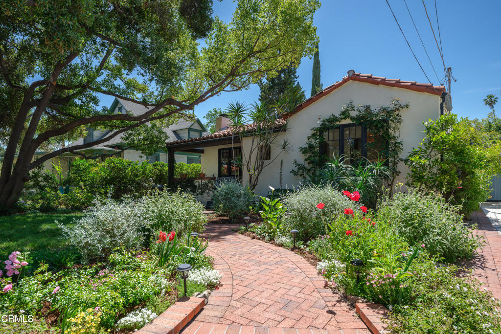 859 Sunset Avenue Pasadena, CA 91103 - Photo 4 of 76 a view of a house with a flower garden
