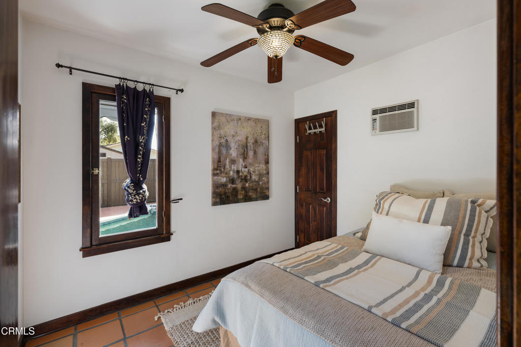 859 Sunset Avenue Pasadena, CA 91103 - Photo 48 of 76 a bedroom with a large bed and a window