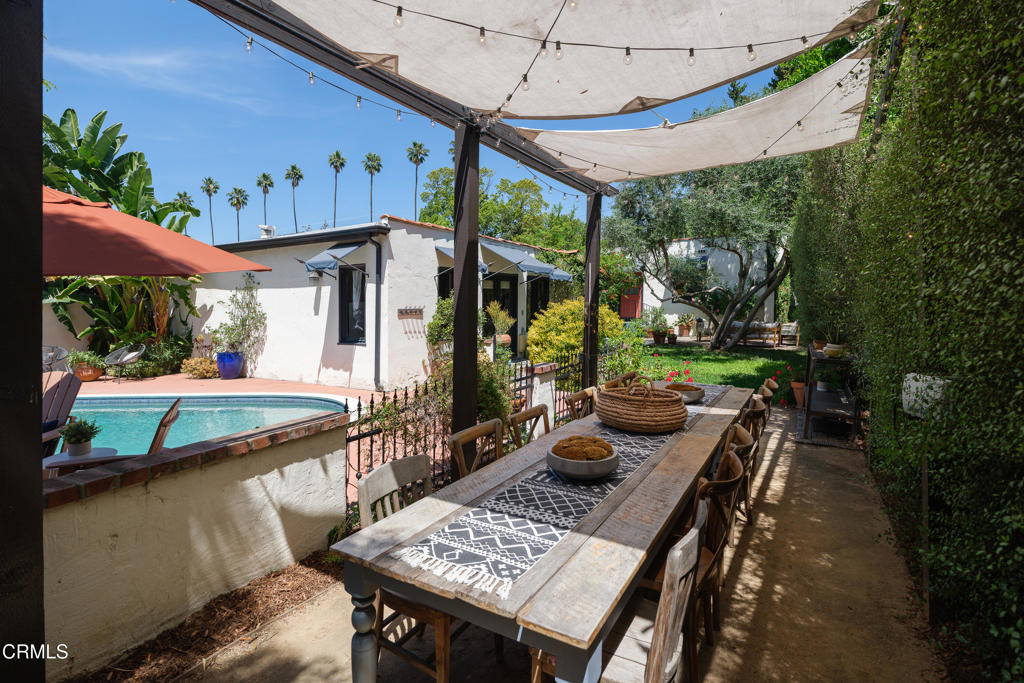 859 Sunset Avenue Pasadena, CA 91103 - Photo 51 of 76 a view of a patio with table and chairs potted plants with wooden floor