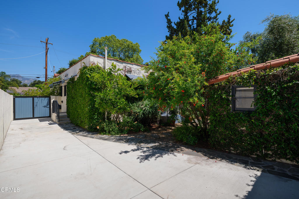 859 Sunset Avenue Pasadena, CA 91103 - Photo 57 of 76 a view of a house with a yard and potted plants